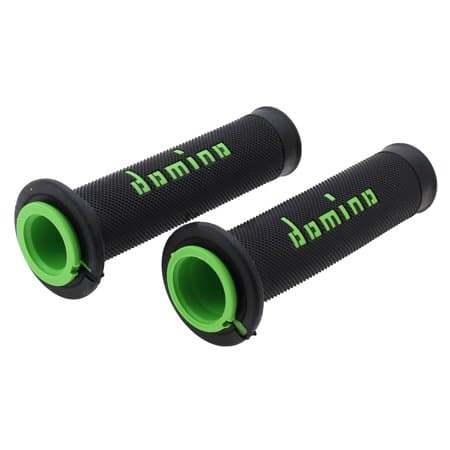Black rubber handlebar grips with textured surface, featuring bright green accents and the "Domino" logo prominently displayed in green on the side.