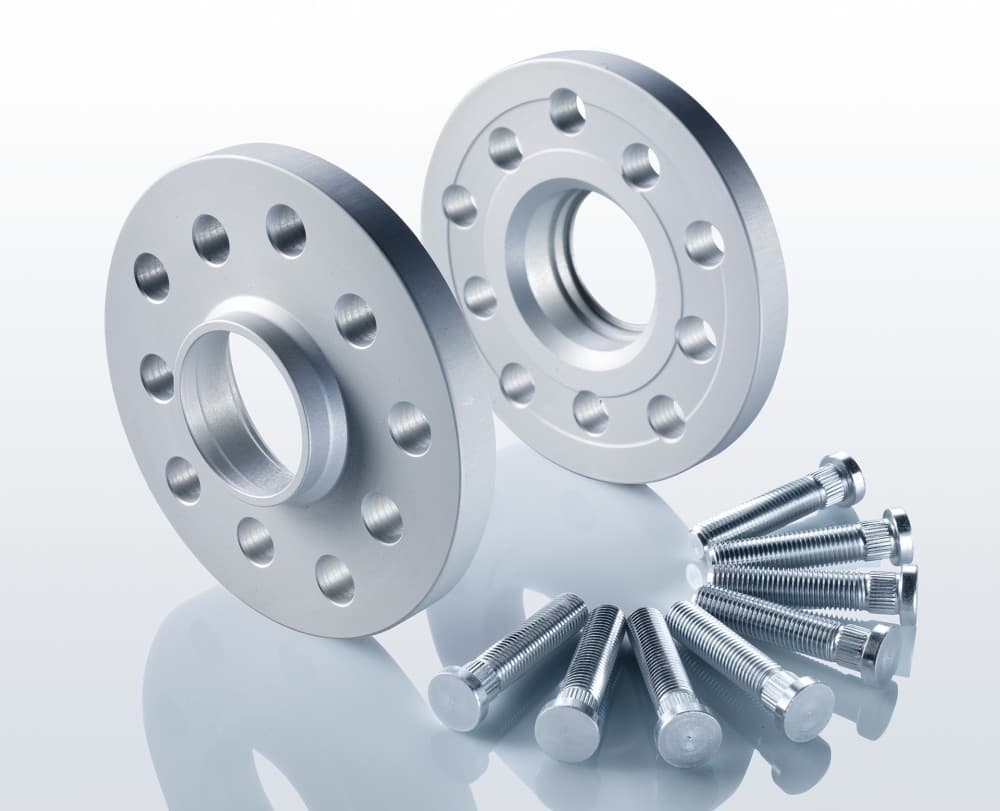 Two silver aluminum track widening spacers, each 10mm thick with 10 holes, accompanied by a set of silver bolts for installation.