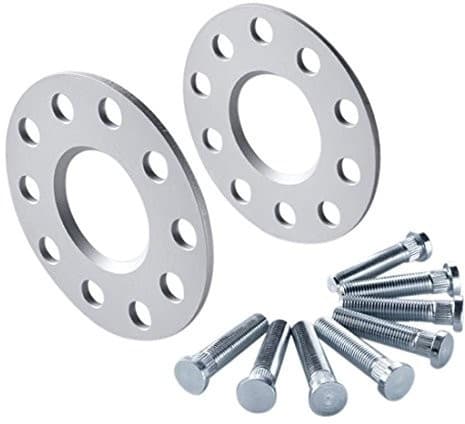 Silver aluminum track widening spacers with four holes, 5mm thickness, accompanied by a set of bolts for installation.