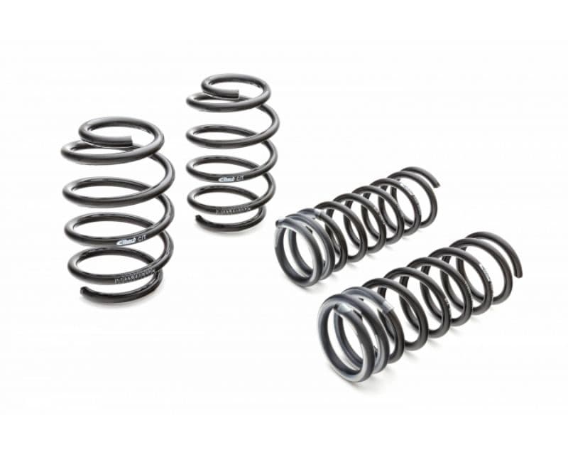 Four black coil springs designed for the 2018-2020 Tesla Performance AWD, featuring a sleek finish and varying coil thickness for enhanced suspension performance.
