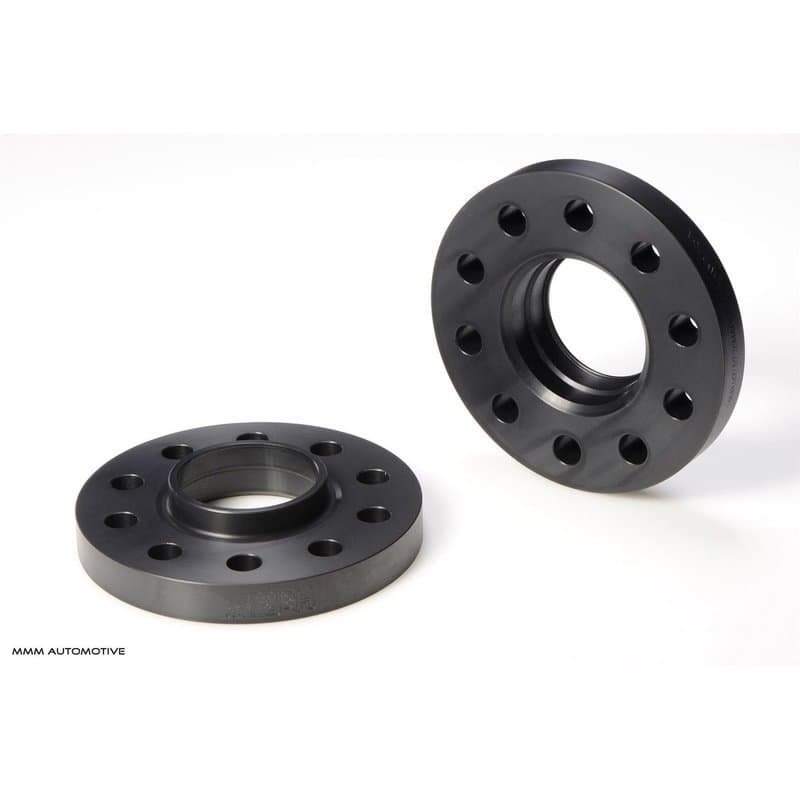 Black aluminum wheel spacers with five holes, each 20mm thick, designed for track widening, featuring a smooth finish and a central hub for secure fitting.