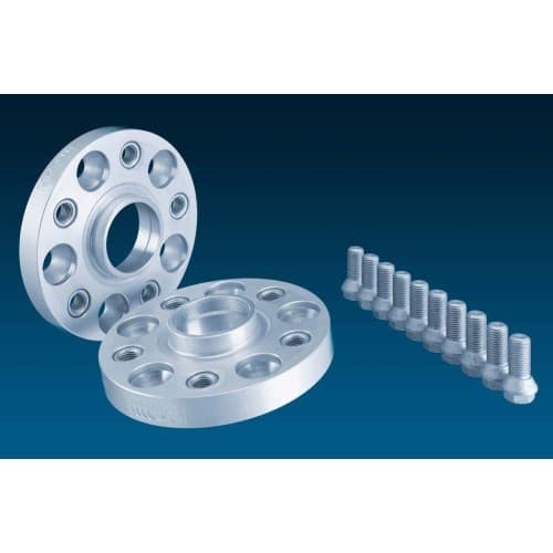 Silver aluminum H&R 5055668 TRAK+® wheel spacers, 25mm thick, featuring five holes for mounting, accompanied by a set of matching bolts against a dark blue background.