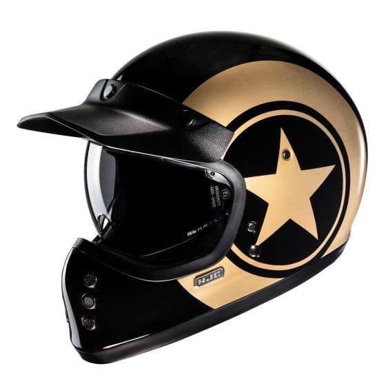 Black and gold full face helmet featuring a prominent star design, a glossy finish, and a visor for enhanced visibility, designed by HJC for motorcycle use.