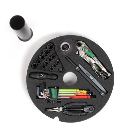 Kielder Layer Cake Hand Tool Kit in black features a circular foam organizer with various tools, including pliers, wrenches, and a marker, all neatly arranged for easy access.