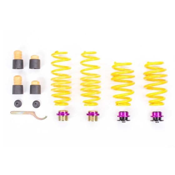 KW Suspension Height-Adjustable Lowering Spring Kit featuring bright yellow springs, purple adjustment caps, and various mounting hardware for lowering vehicle height by 5-30mm.