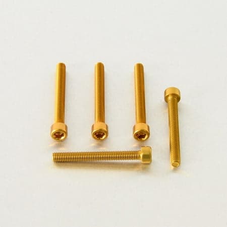 Five gold alloy parallel Allen head bolts, each measuring M6 x 1.00mm x 50mm, showcasing a shiny finish and hexagonal recess for tool engagement.
