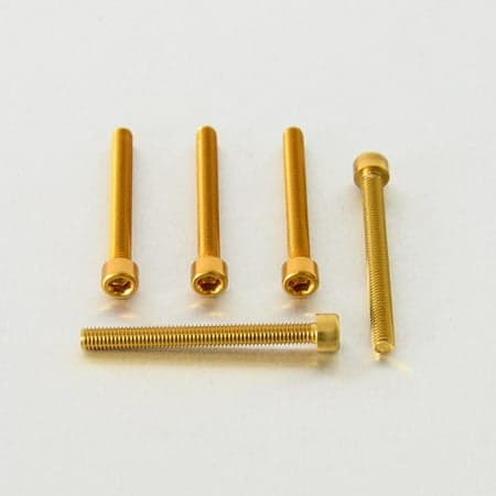 Five gold alloy parallel Allen head bolts, each measuring M6 x 1.00mm x 60mm, showcasing a shiny finish and hexagonal socket for easy installation.