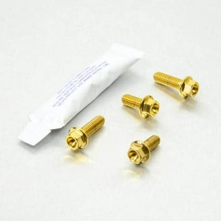 Pro-Bolt Stainless Steel Footrest Heel Plate Bolt Kit in gold, featuring four gold bolts with hexagonal heads and a small packet of thread locker.