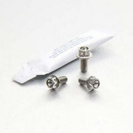 Gold titanium chain guard bolt kit by Pro-Bolt, featuring three shiny bolts with a hexagonal head and a small packet of thread-locking adhesive.