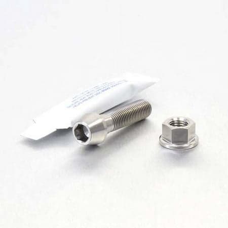 Pro-Bolt Titanium Rear Brake Lever Pivot Bolt Kit in silver, featuring a long, threaded bolt and a hexagonal nut, accompanied by a small tube of thread lock adhesive.