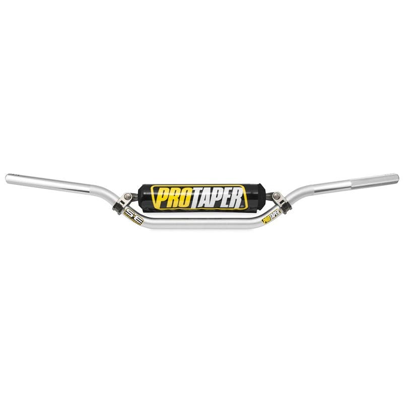 Silver Pro Taper SE MX handlebars with a Carmichael bend, featuring a black and yellow Pro Taper logo on the center pad, designed for motocross performance.