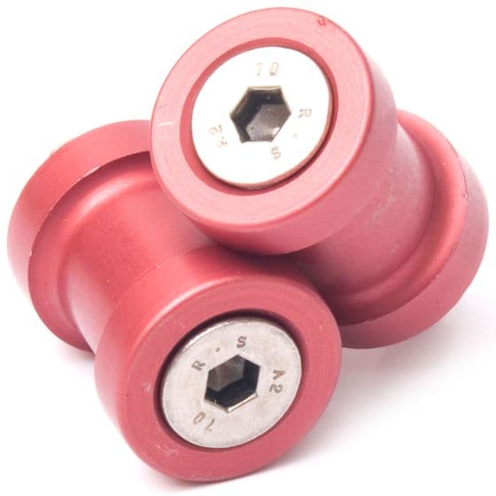 Red aluminum M6 paddock stand bobbins with hexagonal sockets, featuring a smooth finish and a sturdy design for motorcycle support.