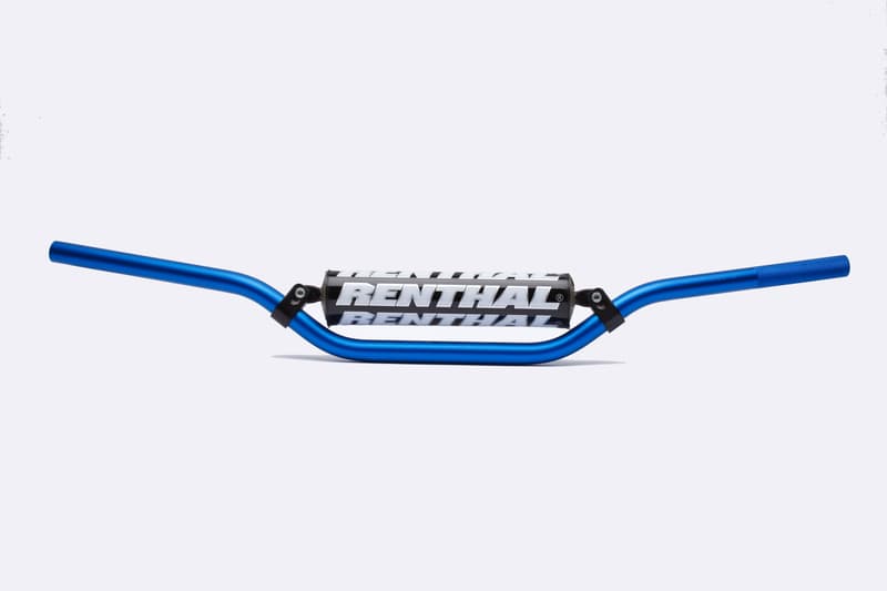 Blue aluminum Renthal MX/Enduro 7/8" handlebar featuring a black center with white "RENTHAL" branding and a curved design for enhanced grip and control.