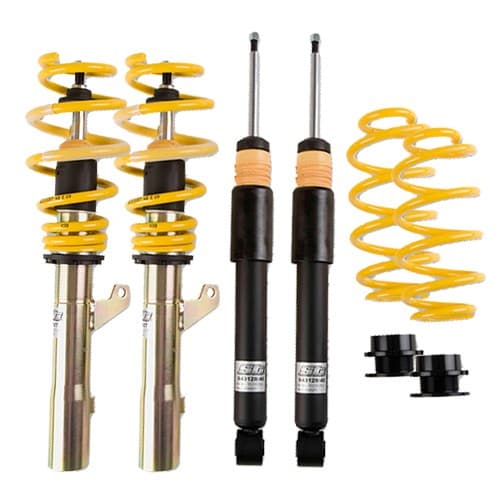 ST Suspension ST X Coilover Kit featuring yellow coil springs, black shock absorbers, and silver metal components, designed to lower vehicle height by 30-65mm in front and 30-60mm in rear.