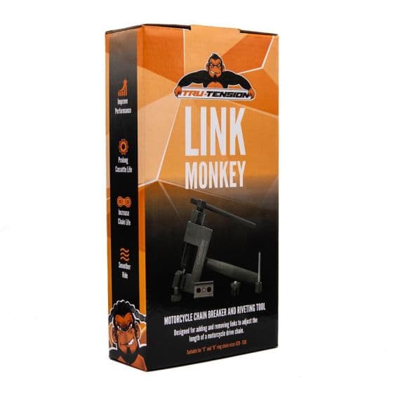 Tru-Tension Link Monkey Chain Breaker Tool in an orange and black box, featuring a motorcycle chain breaker and riveting tool, with a cartoon character logo on the front.