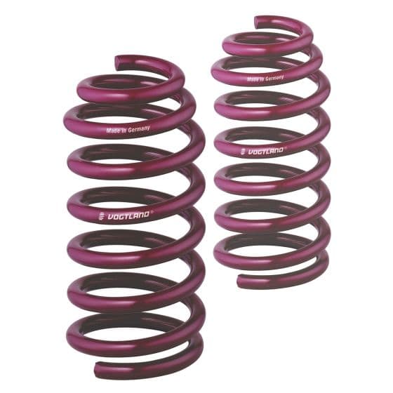 Vogtland Sport Lowering Springs in vibrant purple, featuring a spiral design, designed to lower the front of a vehicle by 30mm, with "Made in Germany" branding visible.