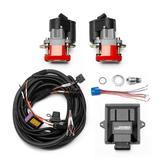 Red powder-coated calipers with electronic parking brake components, including two motors, wiring harness, connectors, and a control module, designed for rear retrofit installation.