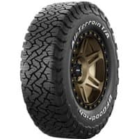 BF Goodrich All-Terrain T/A KO3 tire, rugged tread, black sidewall, white lettering, bronze alloy wheel.