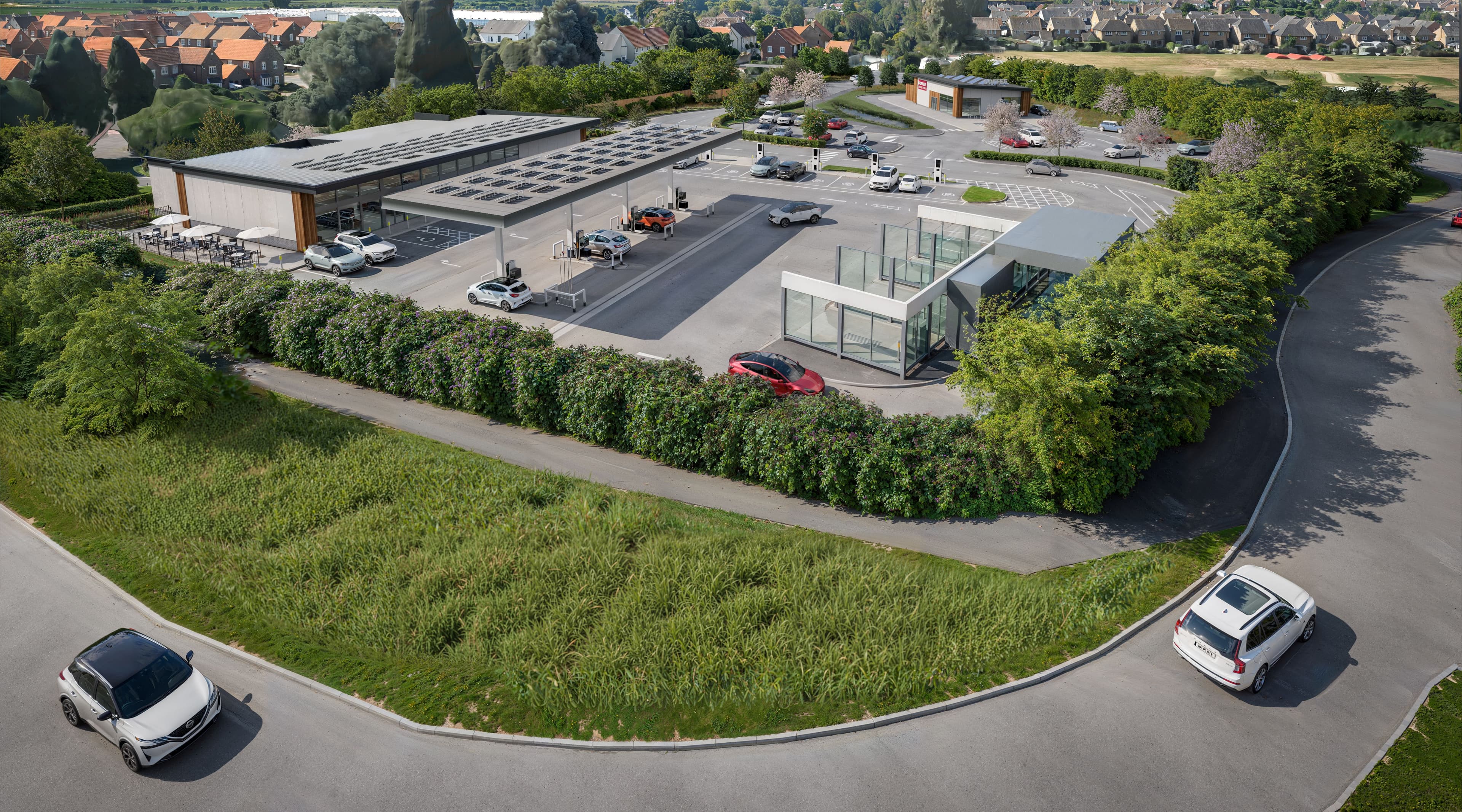 Aerial view of a proposed roadside facility in Brough, featuring modern architecture, parking, and surrounding greenery.