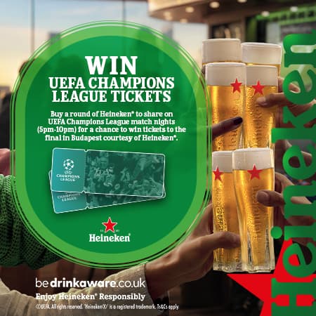 Champions League ticket promotion at a vibrant pub, featuring Heineken glasses and a lively atmosphere.