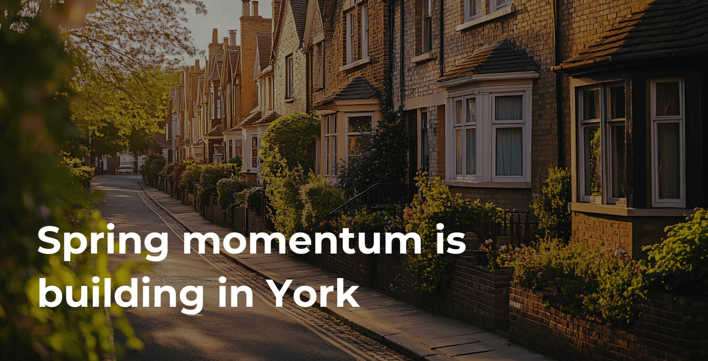 Charming brick houses along a sunny tree-lined street in York