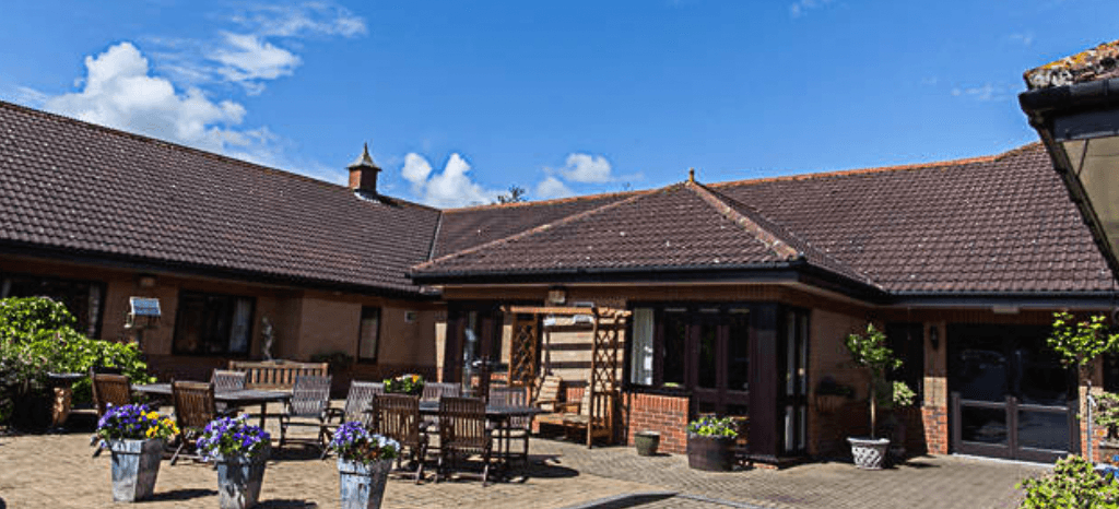 Courtyard with wooden tables at a Yorkshire brick inn