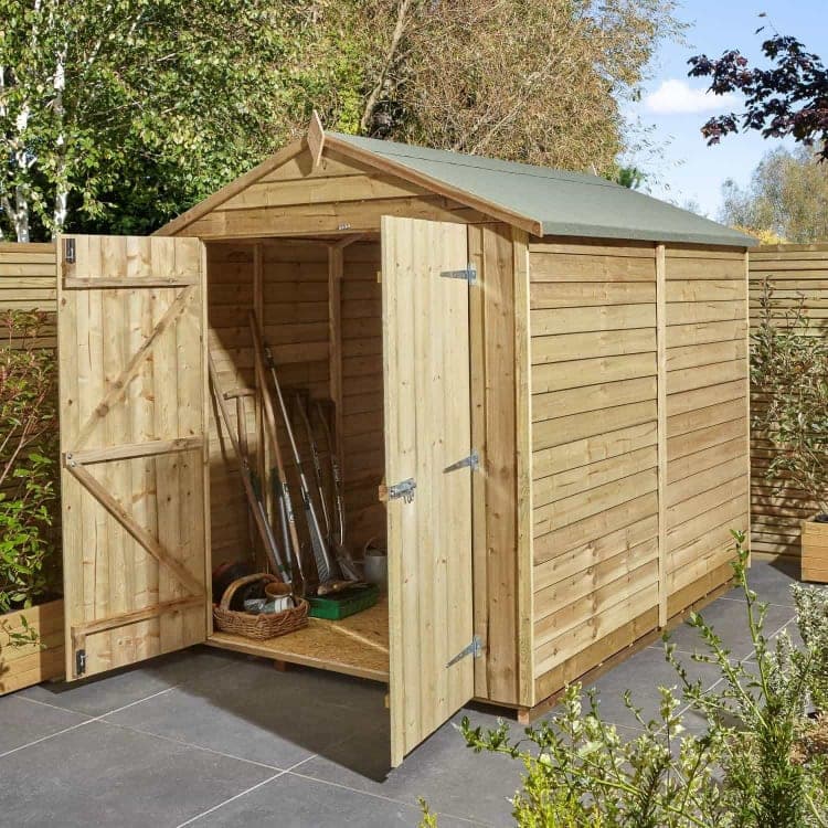 Wooden garden shed with open doors and gardening tools