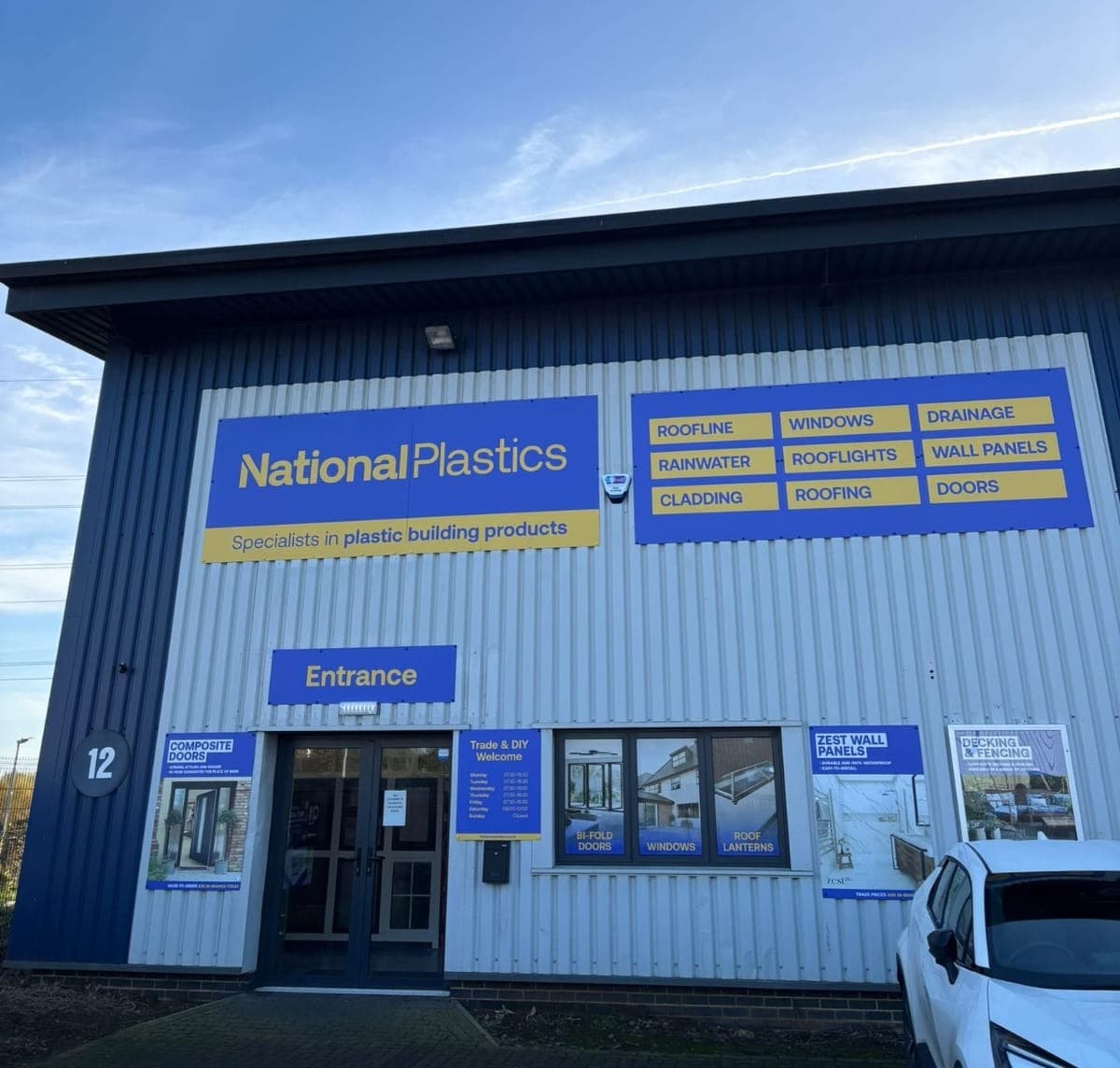 Modern industrial building with blue and yellow signage