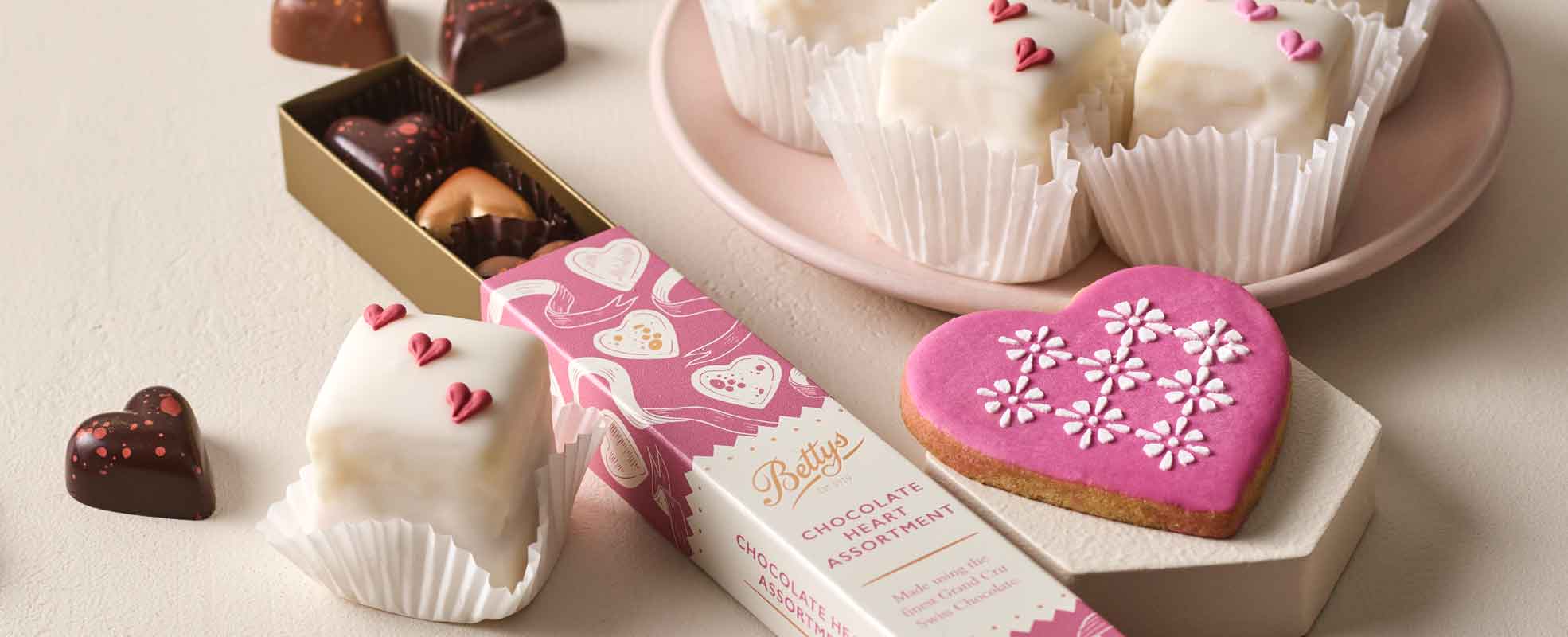 Assorted chocolates and decorated heart-shaped cookies