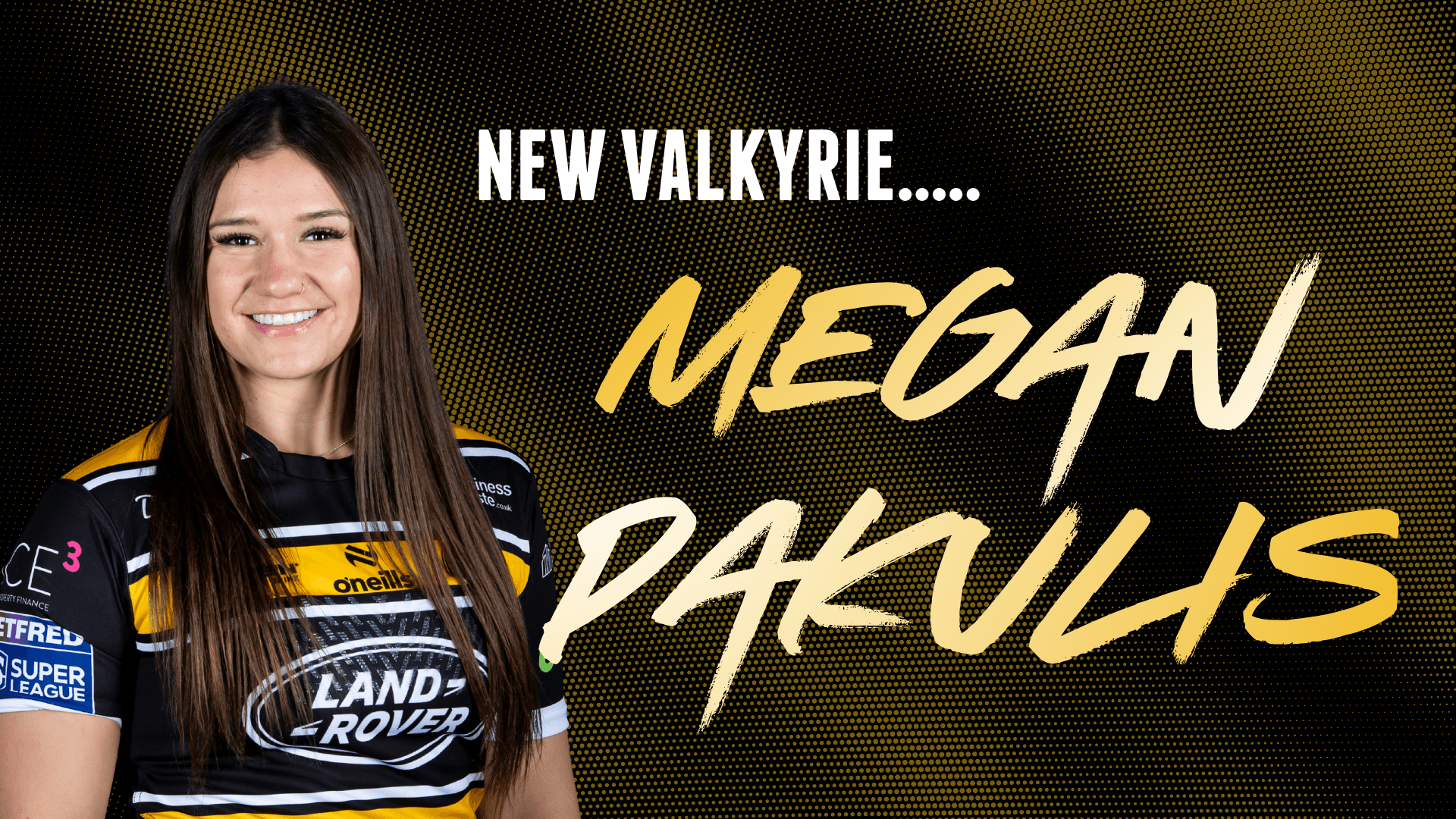 Smiling female rugby player in yellow and black jersey