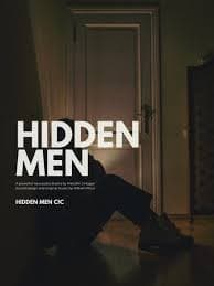 Silhouette of a person sitting against a closed door in dim light