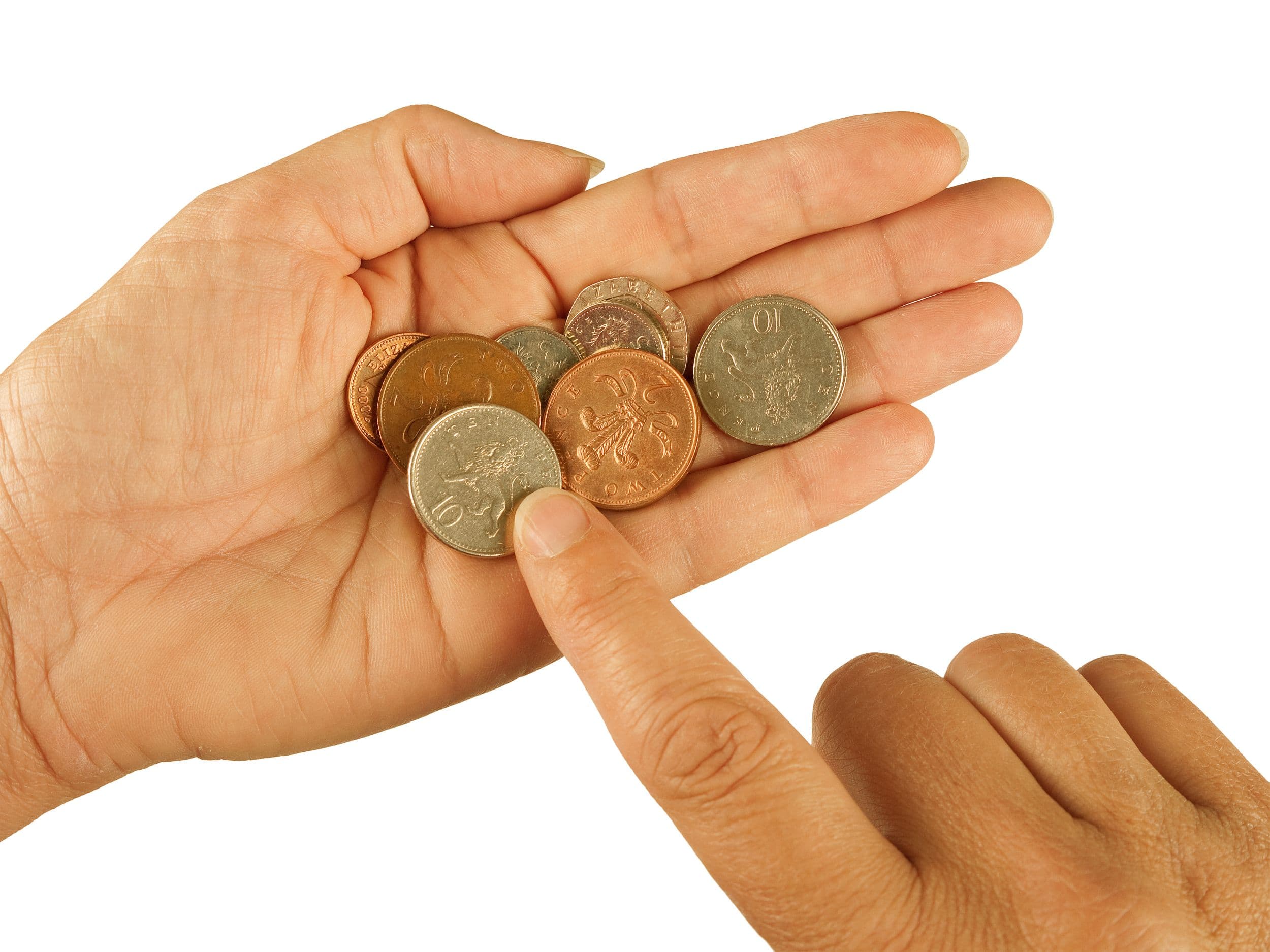 Hand holding British coins with another hand pointing
