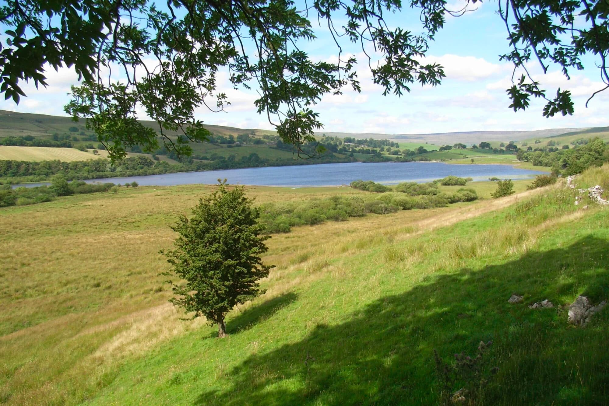 Semerwater viewed from distance in sunshine
