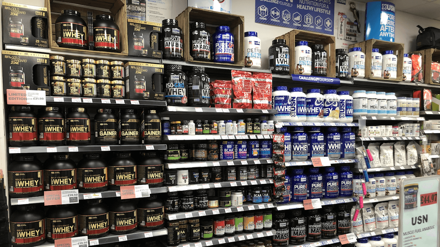 Shelves filled with various protein supplements and nutrition products at BP SPAR Ackworth Service Station.