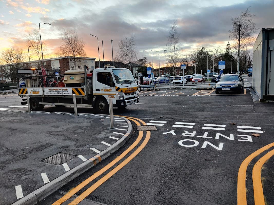 Mark it Right Ltd car park in Aldbrough, Yorkshire, featuring a truck and marked parking spaces at sunset.
