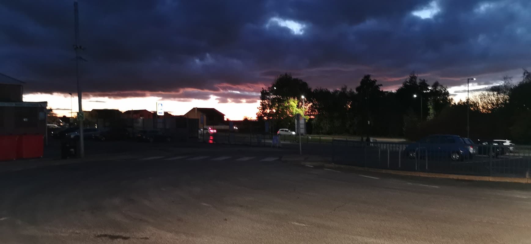Dinnington Interchange at dusk, with dark clouds and a hint of sunset colors illuminating the surroundings.