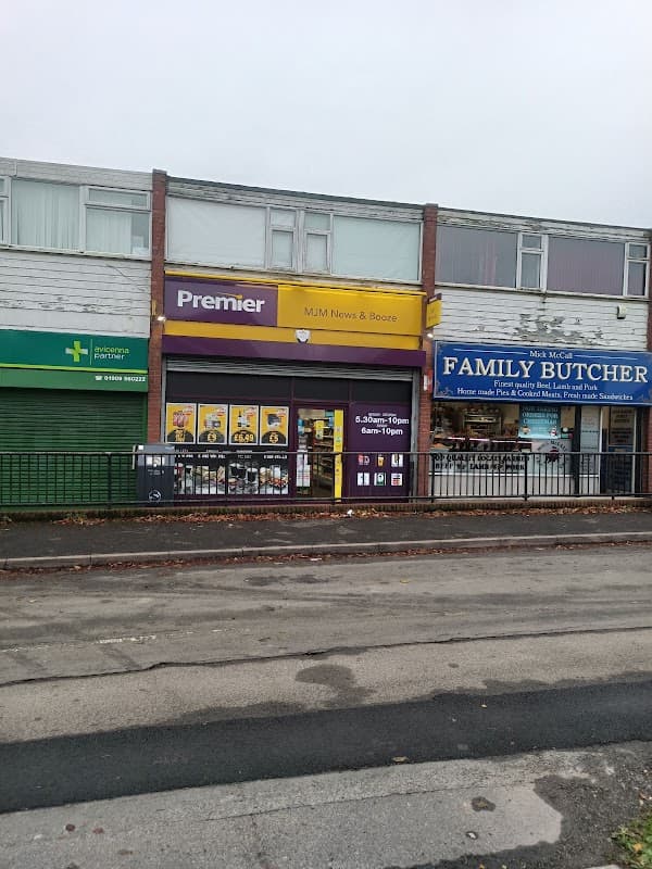 North Anston Pharmacy sign, Premier shopfront, and Family Butcher storefront in Anston, Yorkshire.