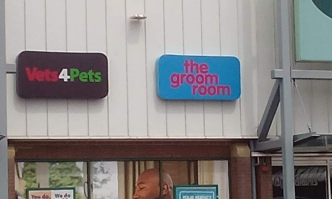 Signage for "Vets4Pets" and "the groom room" on a pet shop exterior in Bradford Idle, Yorkshire.