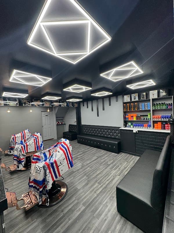 Modern car park interior with sleek black seating, geometric ceiling lights, and organized product displays.
