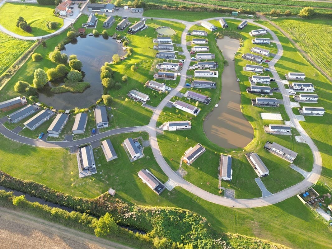 Aerial view of Lakeview Holiday Park featuring caravans, ponds, and green landscapes in Atwick, Yorkshire.