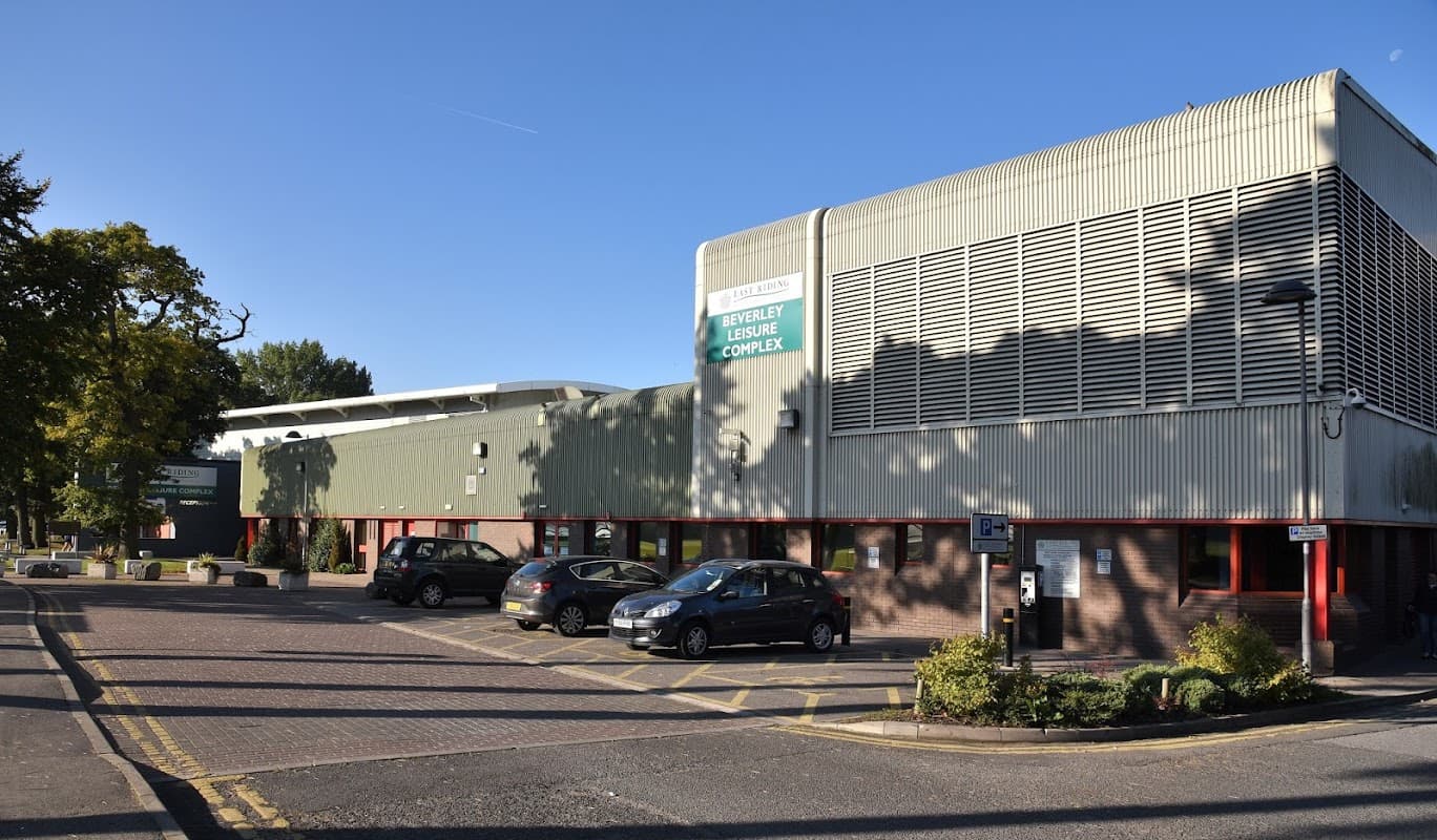 Leisure complex building with modern architecture, parking area, and greenery in Beverley, Yorkshire.