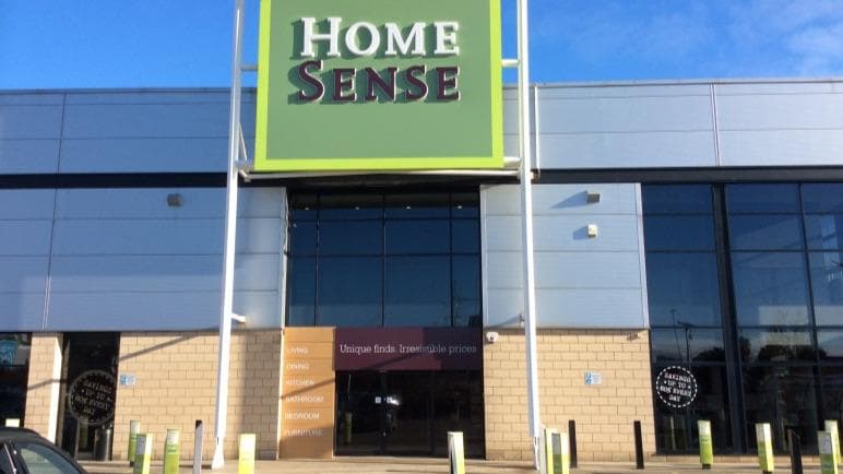 HomeSense store exterior in Birstall, Yorkshire, featuring a large green sign and modern architecture.