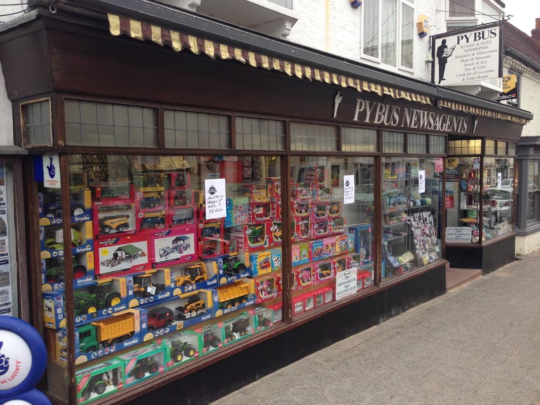 Colorful display of toys and books in the window of Pybus Newsagents in Boroughbridge, Yorkshire.