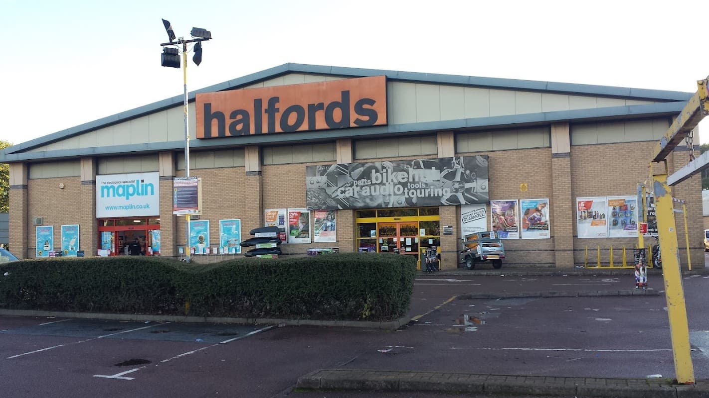 Halfords store exterior in Bradford with signage, parking area, and nearby Maplin store.