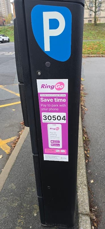 Parking meter with a "RingGo" payment sign, displaying instructions to pay by phone, in Jacobs Well Car Park, Bradford.