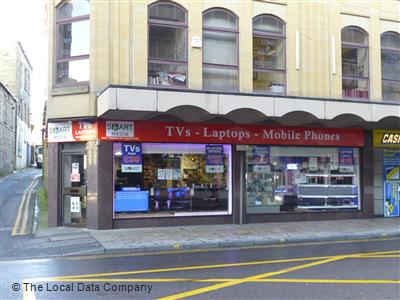 Storefront of Smart Media Tech Limited featuring displays of TVs, laptops, and mobile phones in Bradford, Yorkshire.