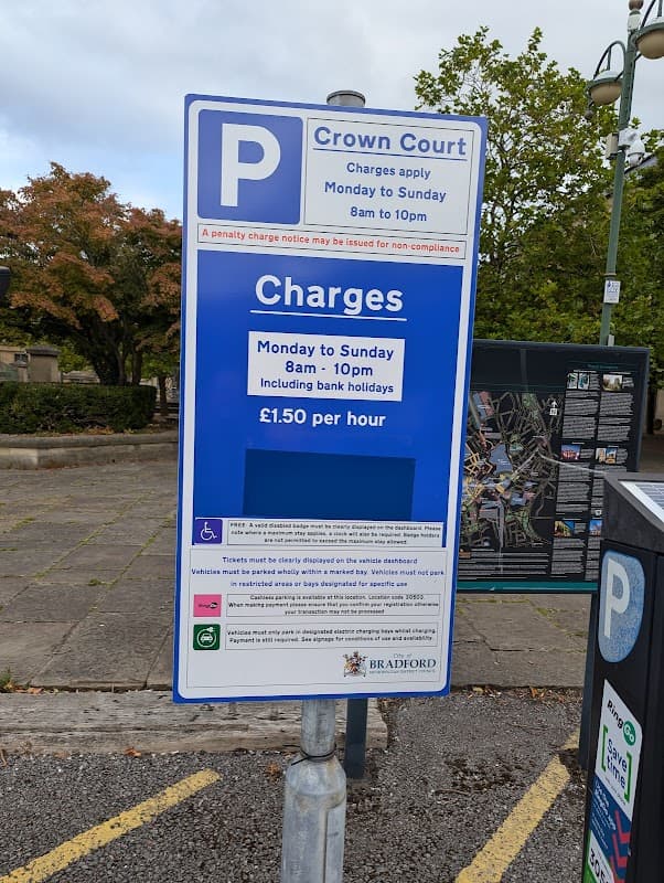 Pay & Display parking sign for Crown Court in Bradford, detailing charges and operating hours.