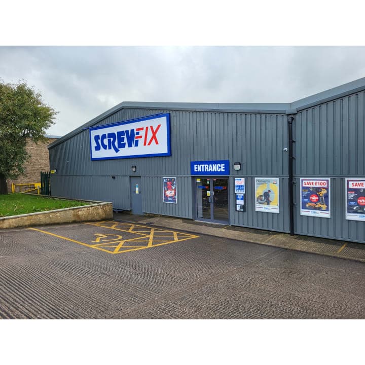 Screwfix store entrance with signage, parking area, and promotional posters in Bradley, North Yorkshire.
