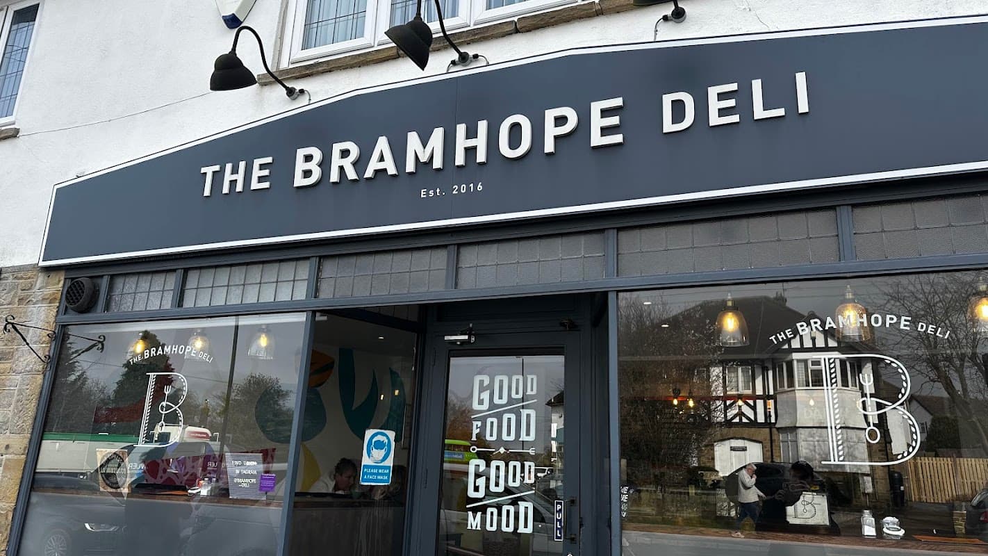 The Bramhope Deli storefront features large windows, modern signage, and a welcoming atmosphere.