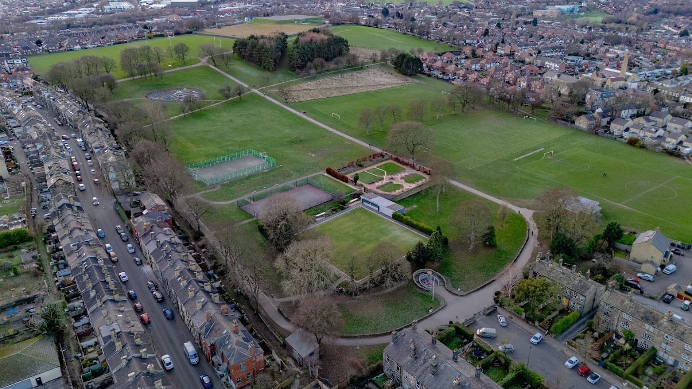 Aerial view of Bramley Park showing green fields, pathways, and surrounding residential areas.